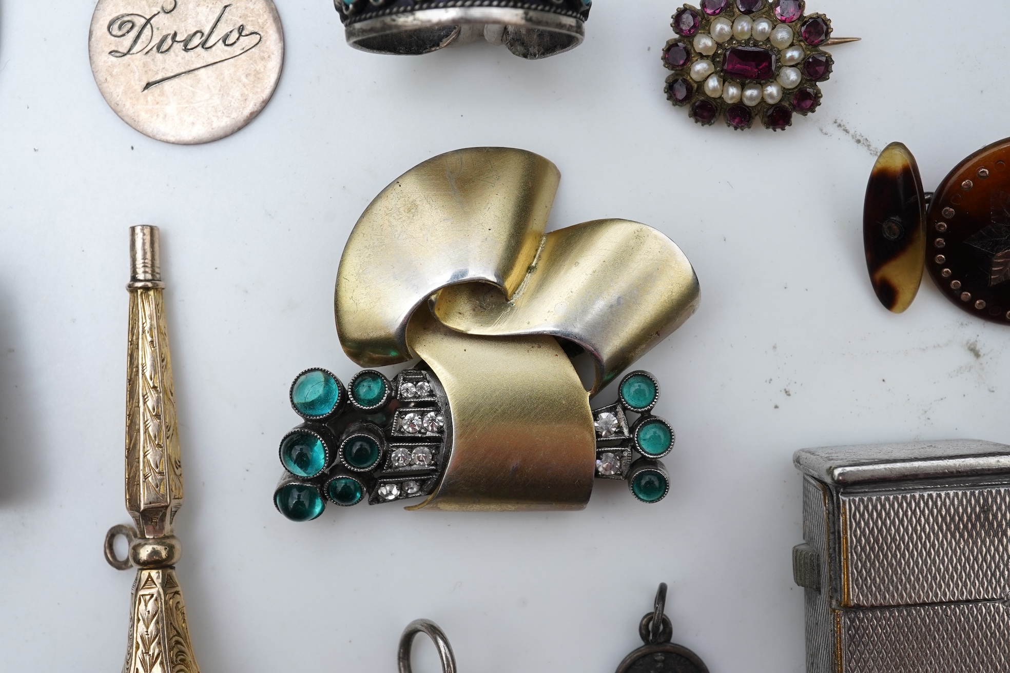 A small group of assorted collectables and jewellery including a Dunhill lighter, 64mm, a George V silver and enamel small compact, silver thimble, two Victorian garnet set brooches, an Edwardian 9ct, amethyst and seed p